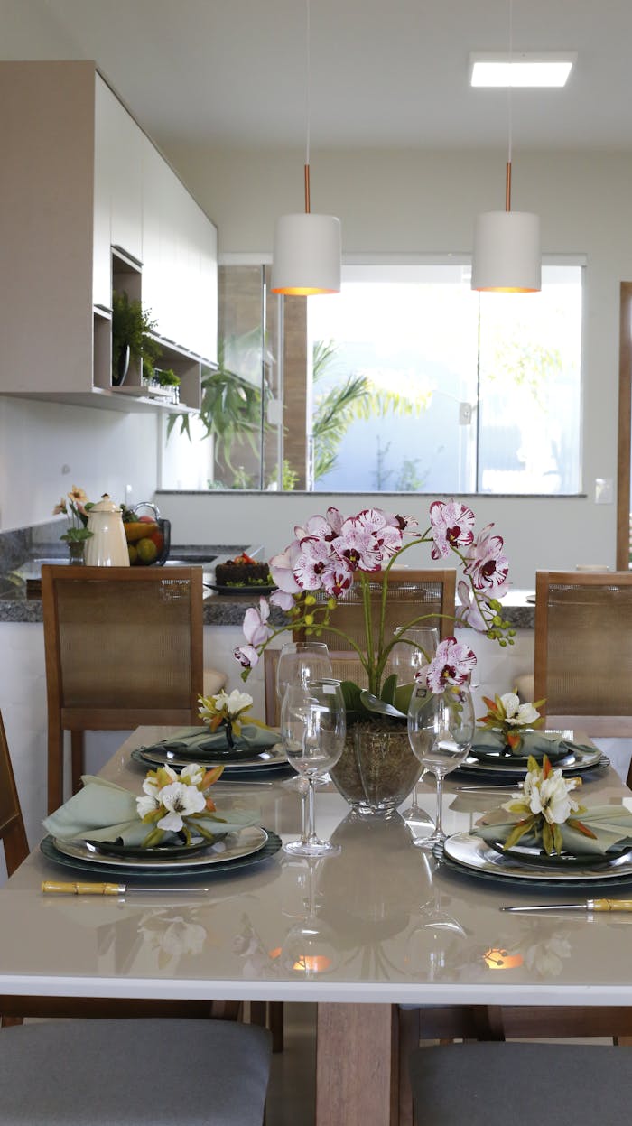 gallery-2 Stylish dining table setup featuring orchids and modern tableware.
