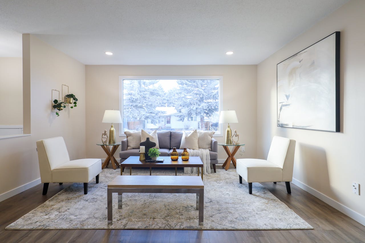 hero-img-01 Stylish living room featuring chic furniture and a snowy window view in Edmonton.